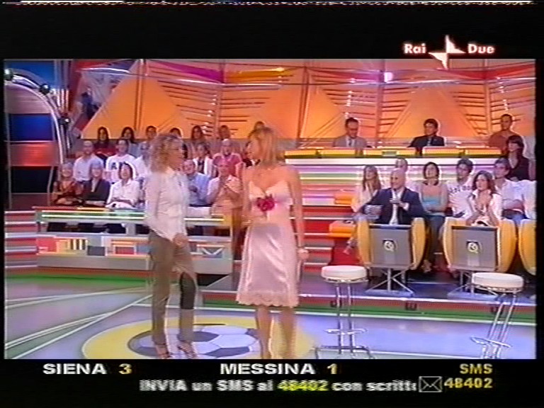 Simona Ventura wear white slip in a TV show 4