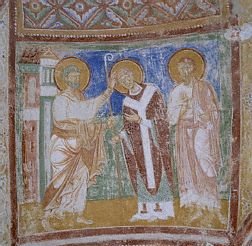San Pietro consacra Sant'Ermacora vescovo di Aquileia con San Marco. (affresco nella Basilica del XII sec.).